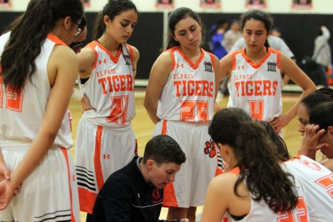 Second-year head coach, Alyssa Faubion, coaching the team during a timeout.