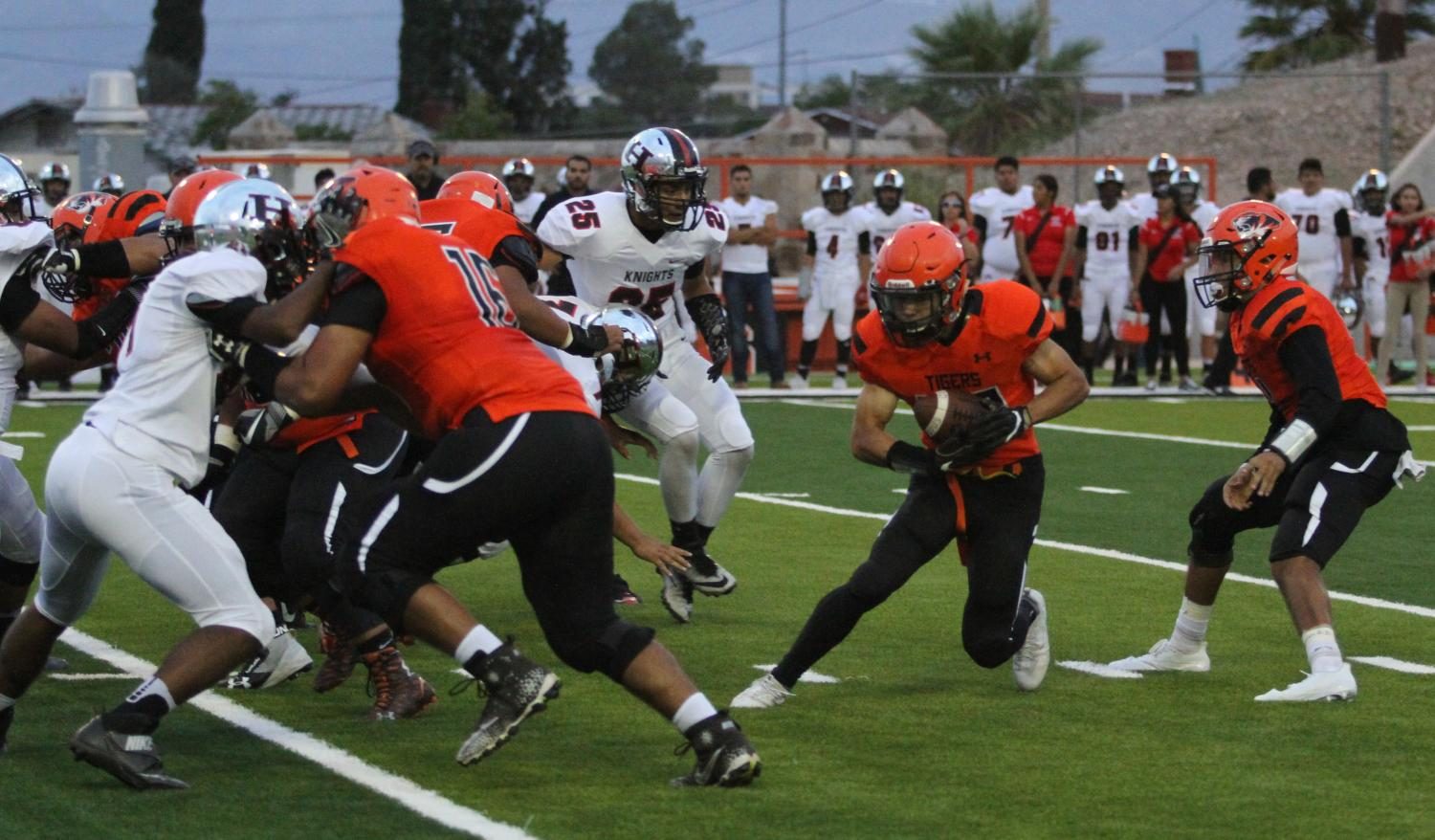 Running back, Shane Rodriguez, takes a hand off from Anthony Escobedo in the 36-28 loss to Hanks.