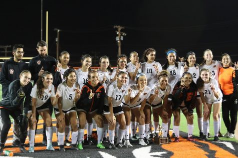 The Tigers celebrate their bi-district championship after defeating Bel Air 2-1 on March 29.