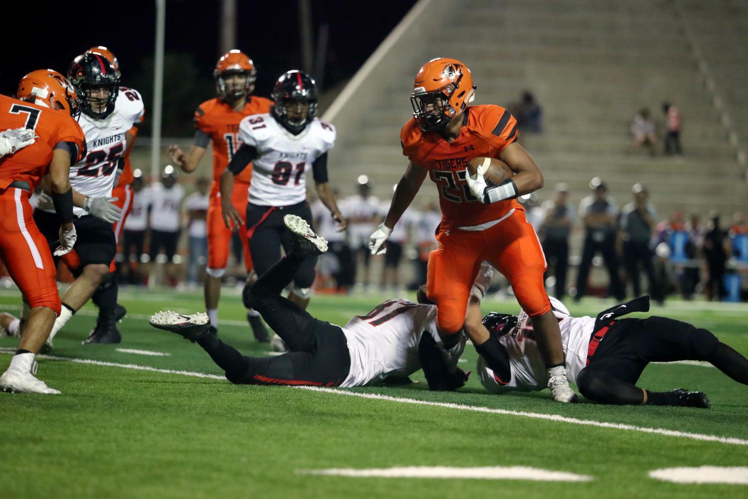 Senior running back, Mario Chavez, breaks through a tackle during the 39-13 loss to Hanks on homecoming night.