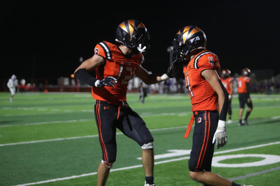 Senior receivers, Gabe Arreola (12) and Christian Carrillo celebrate after an overtime score during the 41-35 win against Irvin on Sept. 24. 