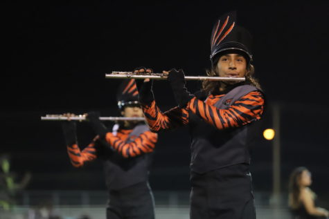 Flautist Eddie Rodriguez performs during the halftime show of the El Paso vs Burges high football game on Nov. 5, 2021.