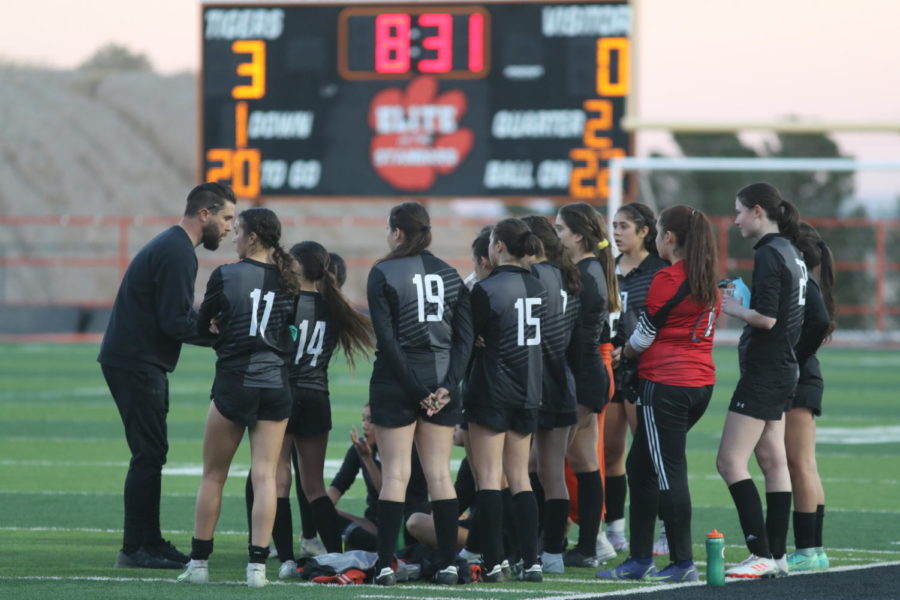 Head coach Peter Fargo speaks to his team during halftime of their 5-1 victory against El Dorado in the first round of the playoffs on March 24.