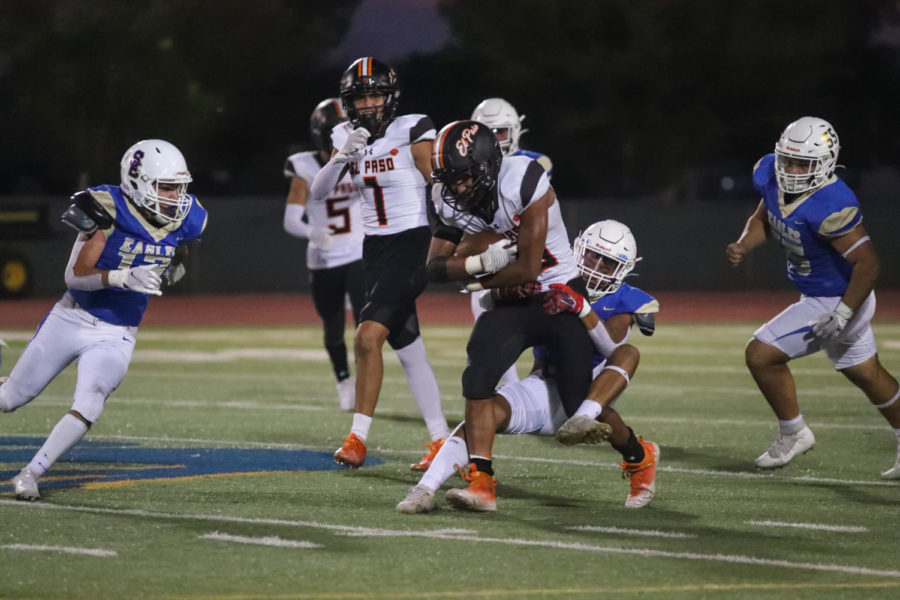 Senior running back Lueranze Johnson drags a tackler during their 45-14 victory against San Elizario on Sept. 9. Lueranze leads the team with 601 rushing yards and 7 touchdowns. 