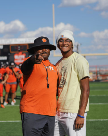 Sgt. 1st Class, Willie Johnson and son Lueranze share a moment on the football field.