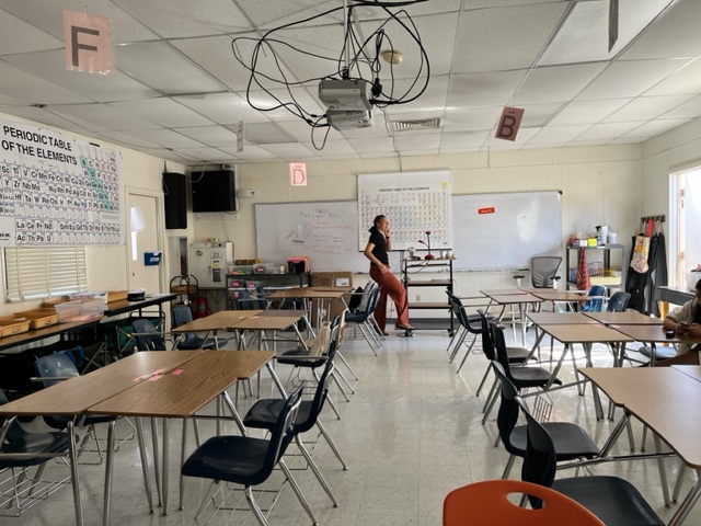 Mrs. Nadia Reese, science teacher, stands in her portable classroom. Shes one of several teachers that were relocated due to Asbestos. The school is the longest standing high school in the city at 106 years.