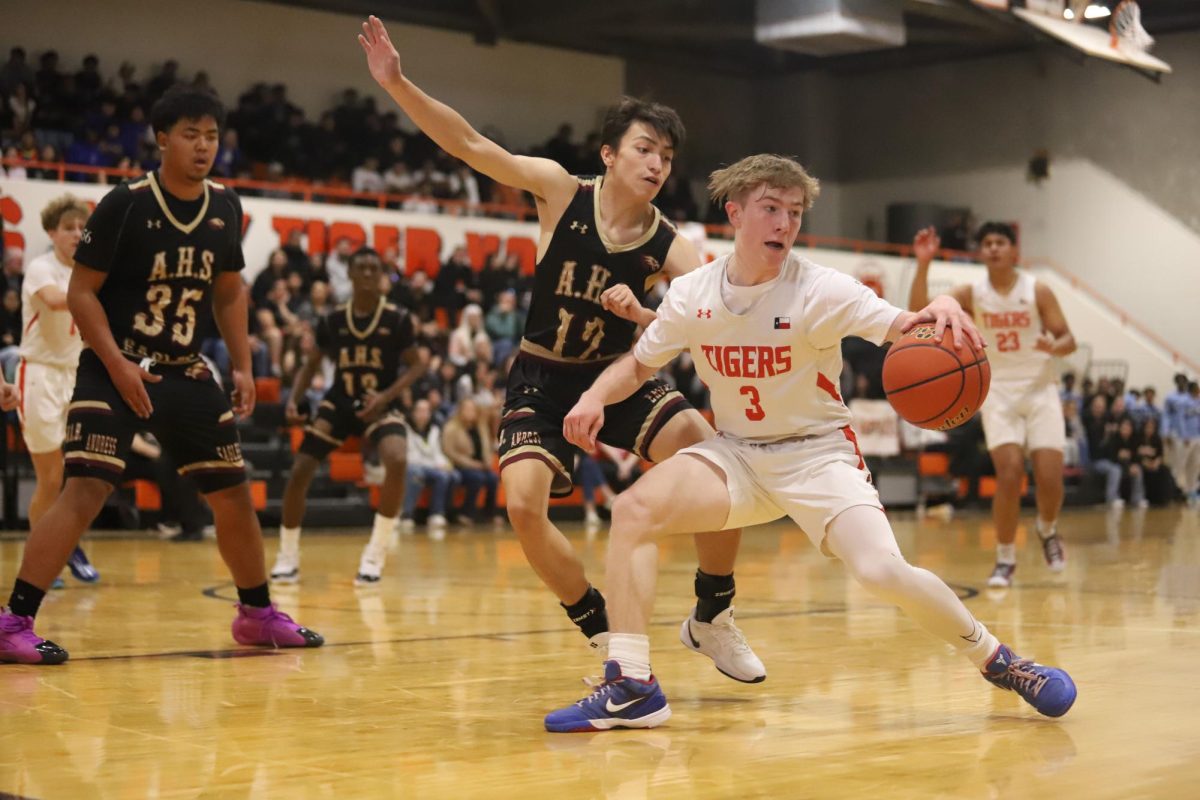 Austin Bunn tries to shake an Austin defender during the CD Jarvis tournament on Nov. 11, 2024.