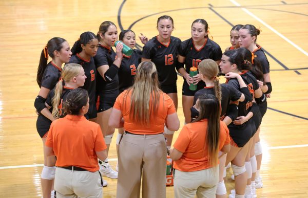 The EPHS varsity volleyball team gathers in a huddle during their match against Immanuel Christian on August 26, 2025.
